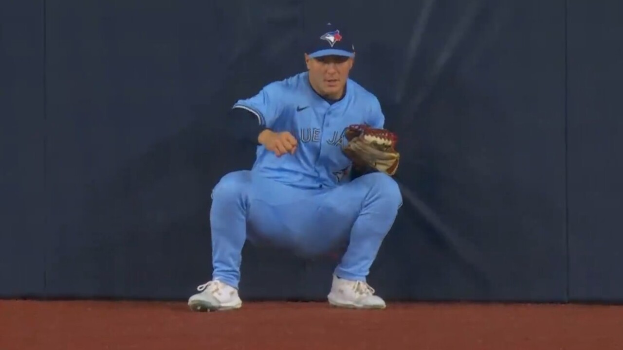 Varsho catches deep ball while falling into centre field wall